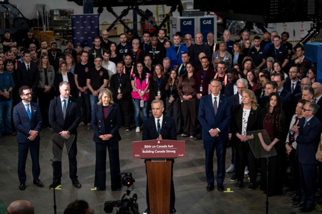 Canadian Prime Minister Mark Carney makes an announcement on new measures to strengthen security, create prosperity, and reinforce strategic autonomy at Canadian Aviation Electronics (CAE), a flight simulation company, in Montreal, Quebec, Canada, on February 17, 2026. (Photo by ANDREJ IVANOV / AFP)