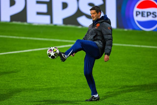 Inter Milan's Romanian head coach Cristian Chivu plays the ball during a training session at the Aspmyra Stadion in Bodoe, Norway on February 17, 2026, on the eve of their UEFA Champions League first-leg, play off football match against Boedo/Glimt. (Photo by Thomas Andersen / NTB / AFP) / Norway OUT