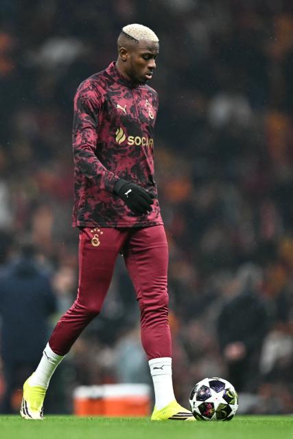 Galatasaray's Nigerian forward #45 Victor Osimhen warms up prior to the UEFA Champions League, knockout round play-off 1st leg, football match between Galatasaray SK and Juventus FC at the Rams Park in Istanbul on February 17, 2026. (Photo by Ozan KOSE / AFP)