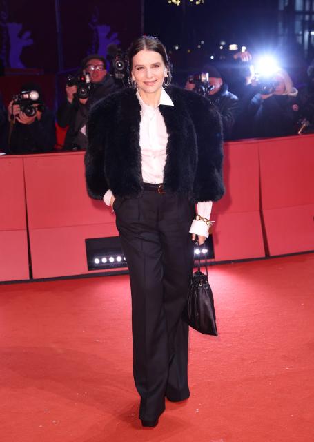 French actress Juliette Binoche poses on the red carpet for the film "Queen at Sea" presented in competition at the 76th Berlinale, Europe's first major film festival of the year, in Berlin on February 17, 2026. (Photo by Ronny HARTMANN / AFP)