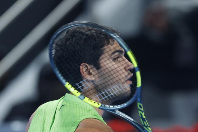 Spain’s Carlos Alcaraz reacts during their men’s singles match against France's Arthur Rinderknech at the Qatar Open tennis tournament in Doha on February 17, 2026. (Photo by Karim JAAFAR / AFP)