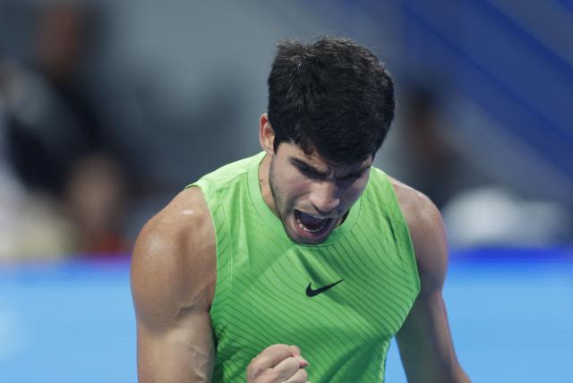 Spain’s Carlos Alcaraz reacts during their men’s singles match against France's Arthur Rinderknech at the Qatar Open tennis tournament in Doha on February 17, 2026. (Photo by Karim JAAFAR / AFP)