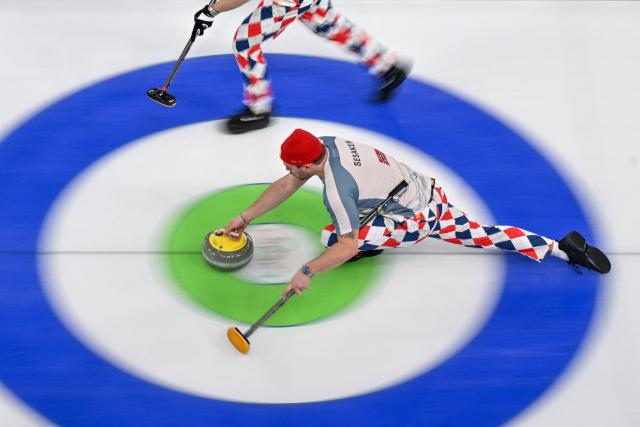 Norway's Martin Sesaker competes in the curling men's round robin between Sweden and Norway during the Milano Cortina 2026 Winter Olympic Games at the Cortina Curling Olympic Stadium in Cortina d’Ampezzo on February 17, 2026. (Photo by Tiziana FABI / AFP)