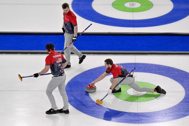 USA's Aidan Oldenburg, USA's Benjamin Richardson adnd USA's Luc Violette compete in the curling men's round robin between USA and Italy during the Milano Cortina 2026 Winter Olympic Games at the Cortina Curling Olympic Stadium in Cortina d’Ampezzo on February 17, 2026. (Photo by Tiziana FABI / AFP)