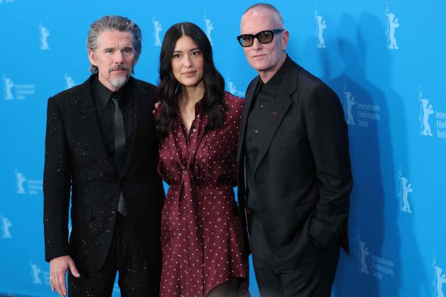 (L-R) US actor Ethan Hawke, US actress Julia Jones and US director Padraic McKinley pose during a photo call for the film 'The Weight' presented in Berlinale Special Gala at the 76th Berlinale, Europe's first major film festival of the year, in Berlin on February 17, 2026. (Photo by Ronny HARTMANN / AFP)