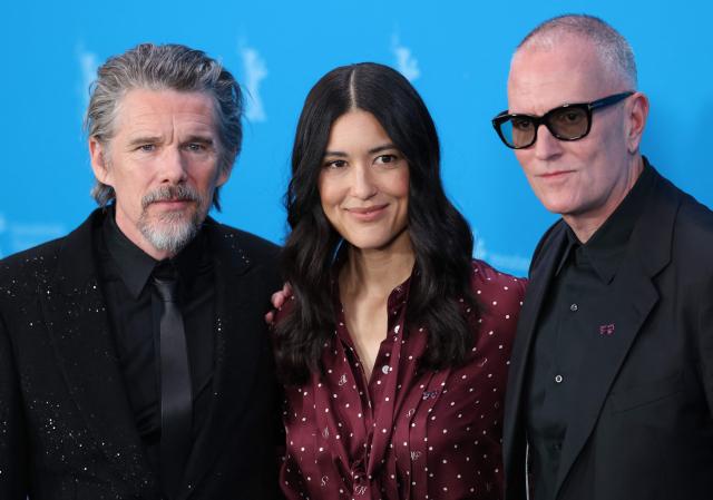 (L-R) US actor Ethan Hawke, US actress Julia Jones and US director Padraic McKinley pose during a photo call for the film 'The Weight' presented in Berlinale Special Gala at the 76th Berlinale, Europe's first major film festival of the year, in Berlin on February 17, 2026. (Photo by Ronny HARTMANN / AFP)