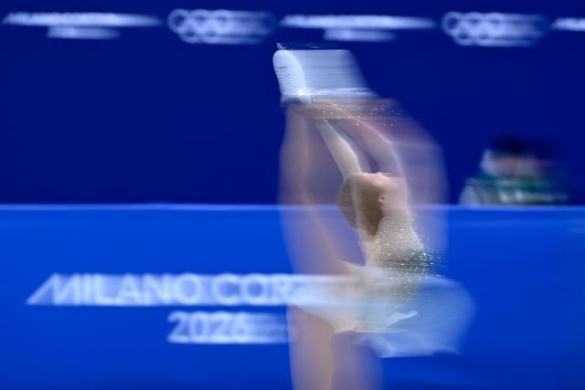 Austria's Olga Mikutina competes in the figure skating women's single skating short program during the Milano Cortina 2026 Winter Olympic Games at Milano Ice Skating Arena in Milan on February 17, 2026. (Photo by WANG Zhao / AFP)