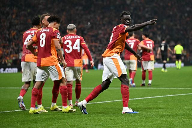 Galatasaray's Colombian defender #06 Davinson Sanchez celebrates scoring his team's third goal during the UEFA Champions League, knockout round play-off 1st leg, football match between Galatasaray SK and Juventus FC at the Rams Park in Istanbul on February 17, 2026. (Photo by OZAN KOSE / AFP)