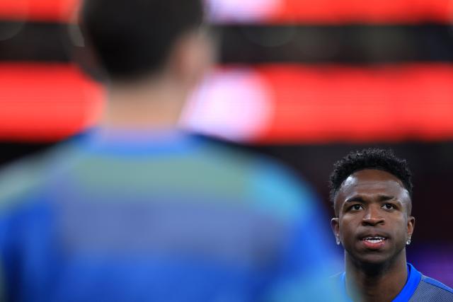 Real Madrid's Brazilian forward #07 Vinicius Junior warms up prior the UEFA Champions League knockout round play-off first leg football match between SL Benfica and Real Madrid CF at Estadio da Luz in Lisbon on February 17, 2026. (Photo by PATRICIA DE MELO MOREIRA / AFP)