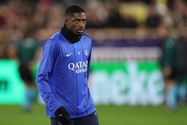Paris Saint-Germain's French forward #10 Ousmane Dembele looks on during the warm-up before the start of the UEFA Champions League knockout round play-off first leg football match between AS Monaco and Paris Saint-Germain at Stade Louis II in the Principality of Monaco on February 17, 2026. (Photo by Valery HACHE / AFP)