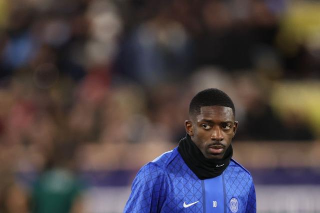 Paris Saint-Germain's French forward #10 Ousmane Dembele looks on during the warm-up before the start of the UEFA Champions League knockout round play-off first leg football match between AS Monaco and Paris Saint-Germain at Stade Louis II in the Principality of Monaco on February 17, 2026. (Photo by Valery HACHE / AFP)