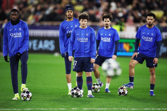 (From L) Paris Saint-Germain's French forward #10 Ousmane Dembele, Paris Saint-Germain's French forward #29 Bradley Barcola, Paris Saint-Germain's Portuguese midfielder #87 Joao Neves, Paris Saint-Germain's Portuguese midfielder #17 Vitinha and Paris Saint-Germain's French midfielder #33 Warren Zaire-Emery warm-up before the start of the UEFA Champions League knockout round play-off first leg football match between AS Monaco and Paris Saint-Germain at Stade Louis II in the Principality of Monaco on February 17, 2026. (Photo by Valery HACHE / AFP)