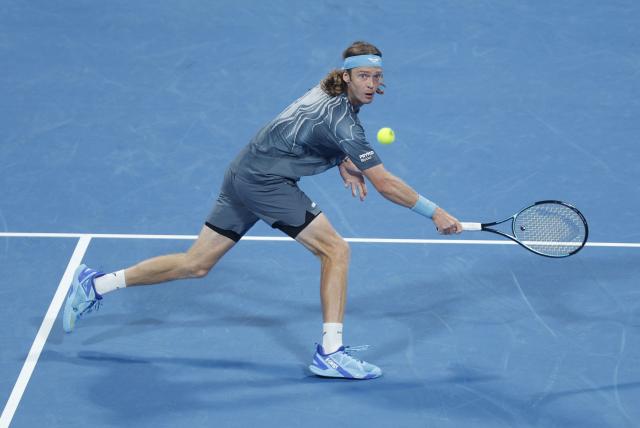 Russia's Andrey Rublev hits a return against Netherlands’ Jesper De Jong during their men’s singles match at the Qatar Open tennis tournament in Doha on February 17, 2026. (Photo by Karim JAAFAR / AFP)