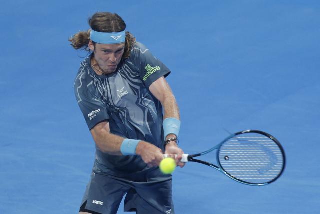 Russia's Andrey Rublev hits a return against Netherlands’ Jesper De Jong during their men’s singles match at the Qatar Open tennis tournament in Doha on February 17, 2026. (Photo by Karim JAAFAR / AFP)