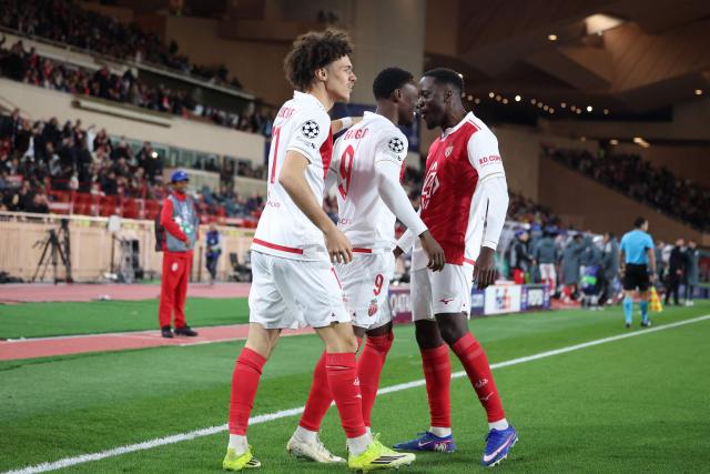 Monaco's US forward #09 Folarin Balogun (C) celebrates scoring his team's first goal during the UEFA Champions League knockout round play-off first leg football match between AS Monaco and Paris Saint-Germain at the Stade Louis II in the Principality of Monaco on February 17, 2026. (Photo by Valery HACHE / AFP)