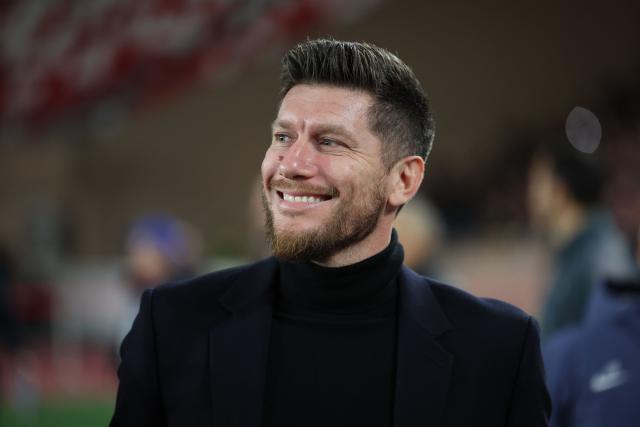 Monaco's Belgian head coach Sebastien Pocognoli looks on before the start of the UEFA Champions League knockout round play-off first leg football match between AS Monaco and Paris Saint-Germain at Stade Louis II in the Principality of Monaco on February 17, 2026. (Photo by Valery HACHE / AFP)