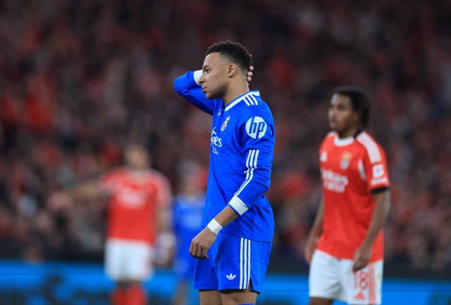 Real Madrid's French forward #10 Kylian Mbappe reacts during the UEFA Champions League knockout round play-off first leg football match between SL Benfica and Real Madrid CF at Estadio da Luz in Lisbon on February 17, 2026. (Photo by PATRICIA DE MELO MOREIRA / AFP)