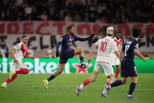 Paris Saint-Germain's French forward #29 Bradley Barcola (2L) controls the ball during the UEFA Champions League knockout round play-off first leg football match between AS Monaco and Paris Saint-Germain at the Stade Louis II in the Principality of Monaco on February 17, 2026. (Photo by Valery HACHE / AFP)