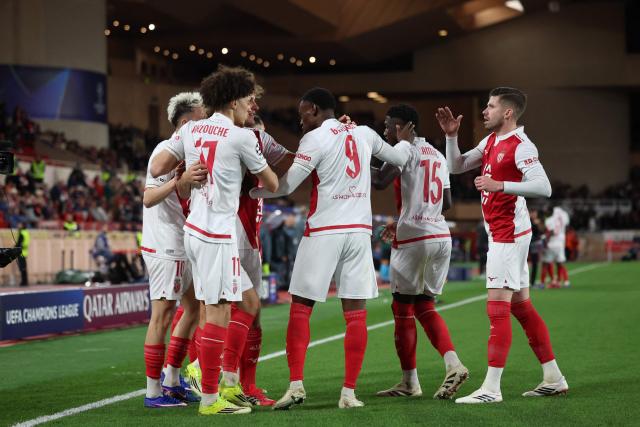 Monaco's US forward #09 Folarin Balogun (C) celebrates with teammates after scoring his team's second goalduring the UEFA Champions League knockout round play-off first leg football match between AS Monaco and Paris Saint-Germain at the Stade Louis II in the Principality of Monaco on February 17, 2026. (Photo by Valery HACHE / AFP)