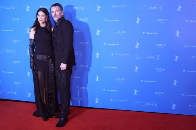 US actress Julia Jones and US actor Ethan Hawke pose on the red carpet for the film 'The Weight' presented in Berlinale Special Gala at the 76th Berlinale, Europe's first major film festival of the year, in Berlin on February 17, 2026. (Photo by Ronny HARTMANN / AFP)