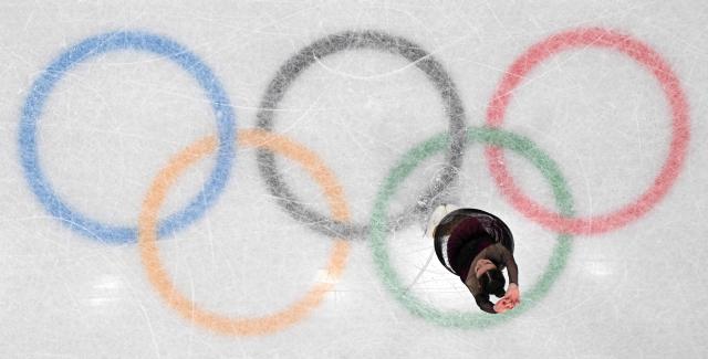 Italy's Lara Naki Gutmann competes in the figure skating women's single skating short program during the Milano Cortina 2026 Winter Olympic Games at Milano Ice Skating Arena in Milan on February 17, 2026. (Photo by Antonin THUILLIER / AFP)