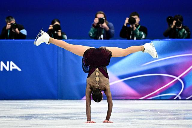 Italy's Lara Naki Gutmann competes in the figure skating women's single skating short program during the Milano Cortina 2026 Winter Olympic Games at Milano Ice Skating Arena in Milan on February 17, 2026. (Photo by JULIEN DE ROSA / AFP)