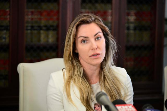 Crystal Hefner, widow of Playboy founder Hugh Hefner, speaks at a press conference with attorney Gloria Allred to announce steps they're taking to protect sexual images and information about women in Hefner's personal scrapbooks and diary in Los Angeles on February 17, 2026. (Photo by Frederic J. Brown / AFP)