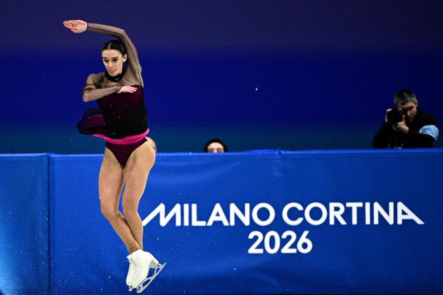 Italy's Lara Naki Gutmann competes in the figure skating women's single skating short program during the Milano Cortina 2026 Winter Olympic Games at Milano Ice Skating Arena in Milan on February 17, 2026. (Photo by JULIEN DE ROSA / AFP)