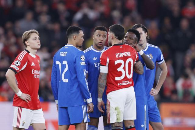 Real Madrid's French forward #10 Kylian Mbappe reacts after Real Madrid's Brazilian forward #07 Vinicius Junior (2R) listened racists insults during the UEFA Champions League knockout round play-off first leg football match between SL Benfica and Real Madrid CF at Estadio da Luz in Lisbon on February 17, 2026. (Photo by FILIPE AMORIM / AFP)