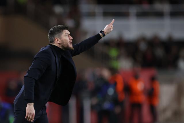 Monaco's Belgian head coach Sebastien Pocognoli gestures during the UEFA Champions League knockout round play-off first leg football match between AS Monaco and Paris Saint-Germain at the Stade Louis II in the Principality of Monaco on February 17, 2026. (Photo by Valery HACHE / AFP)