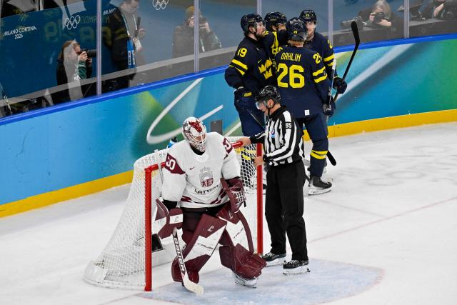 Latvia's #30 Elvis Merzlikins reacts after Sweden score their 5-1 goal during the men's qualification play-off ice hockey match between Sweden and Latvia at the Milano Santagiulia Ice Hockey Arena during the Milano Cortina 2026 Winter Olympic Games in Milan, on February 17, 2026. (Photo by Alexander NEMENOV / AFP)