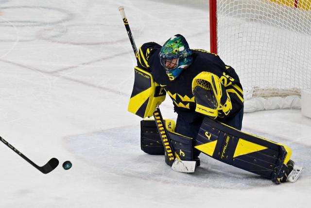 Sweden's #25 Jacob Markstrom keeps his eye on the puck before making a save during the men's qualification play-off ice hockey match between Sweden and Latvia at the Milano Santagiulia Ice Hockey Arena during the Milano Cortina 2026 Winter Olympic Games in Milan, on February 17, 2026. (Photo by Alexander NEMENOV / AFP)
