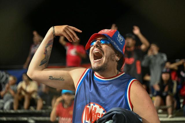 A fan of Independiente Medellin cheers for his team ahead of the Copa Libertadores phase two first-leg football match between Uruguay's Liverpool and Colombia's Independiente Medellin at the Alfredo Victor Viera Park Stadium in Montevideo on February 17, 2026. (Photo by EITAN ABRAMOVICH / AFP)