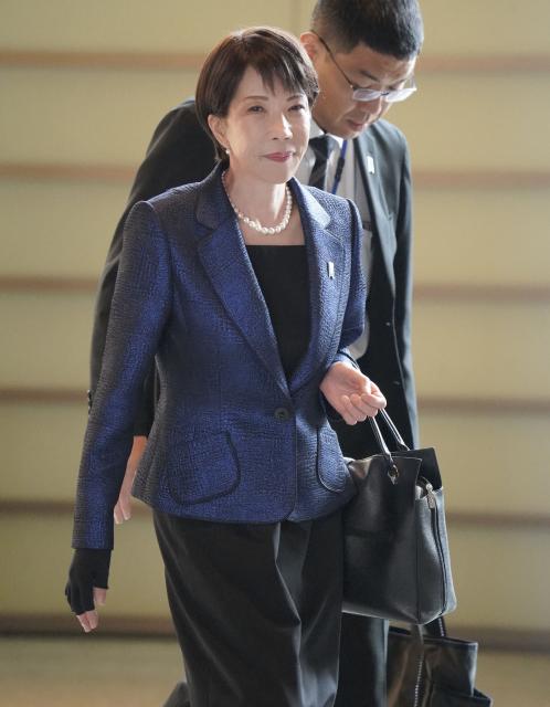 Japan's Prime Minister Sanae Takaichi enters the Prime Minister's Office in Tokyo on February 18, 2026. (Photo by JIJI PRESS / AFP) / Japan OUT