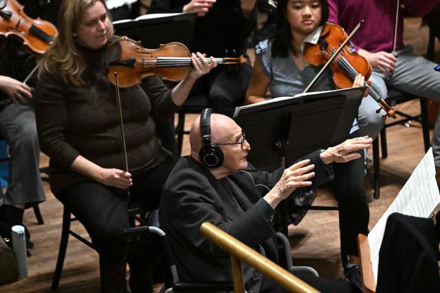 Hungarian composer Gyorgy Kurtag is seen on the stage of the Liszt Ferenc Academy of Music in Budapest on February 7, 2026 during his workshop with Hungarian symphony orchestra. The management of the Academy of Music paid tribute to the living legend of contemporary music who will celebrate his 100th birthday on February 19, 2026. (Photo by Attila KISBENEDEK / AFP)
