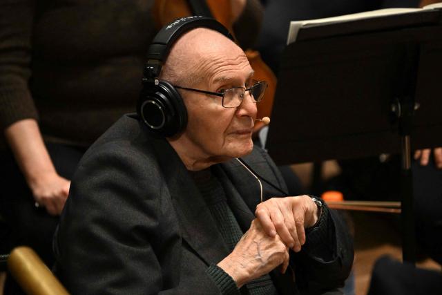 Hungarian composer Gyorgy Kurtag sits on the stage of the Liszt Ferenc Academy of Music in Budapest on February 7, 2026 prior to his workshop with the Hungarian symphony orchestra. The management of the Academy of Music paid tribute to the living legend of contemporary music who will celebrate his 100th birthday on February 19, 2026. (Photo by Attila KISBENEDEK / AFP)