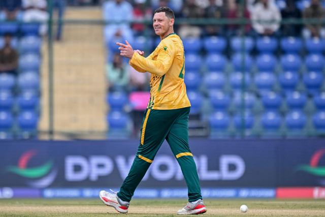 South Africa's George Linde celebrates after taking the wicket of UAE's captain Muhammad Waseem during the 2026 ICC Men's T20 Cricket World Cup group stage match between South Africa and United Arab Emirates at the Arun Jaitley Stadium in New Delhi on February 18, 2026. (Photo by Arun SANKAR / AFP)