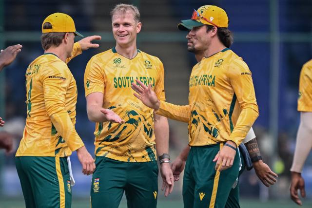 South Africa's Corbin Bosch (2L) celebrates with teammates after taking the wicket of UAE's Aryansh Sharma during the 2026 ICC Men's T20 Cricket World Cup group stage match between South Africa and United Arab Emirates at the Arun Jaitley Stadium in New Delhi on February 18, 2026. (Photo by Arun SANKAR / AFP)