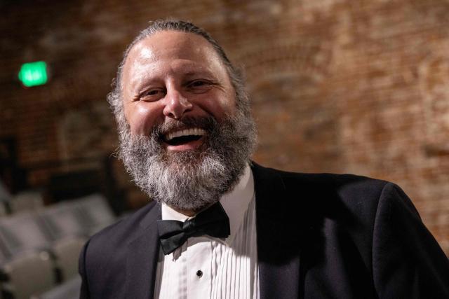 Background actor, Scott Perry, poses at the end of the 8th Annual Los Angeles Union Background Actors Awards ceremony at the Broadwater, in Los Angeles, California, on February 15, 2026. (Photo by ETIENNE LAURENT / AFP)