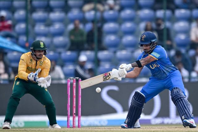 UAE's Haider Shah (R) plays a shot during the 2026 ICC Men's T20 Cricket World Cup group stage match between South Africa and United Arab Emirates at the Arun Jaitley Stadium in New Delhi on February 18, 2026. (Photo by Arun SANKAR / AFP)