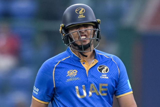 UAE's Alishan Sharafu reacts after being hit by the ball during the 2026 ICC Men's T20 Cricket World Cup group stage match between South Africa and United Arab Emirates at the Arun Jaitley Stadium in New Delhi on February 18, 2026. (Photo by Arun SANKAR / AFP)