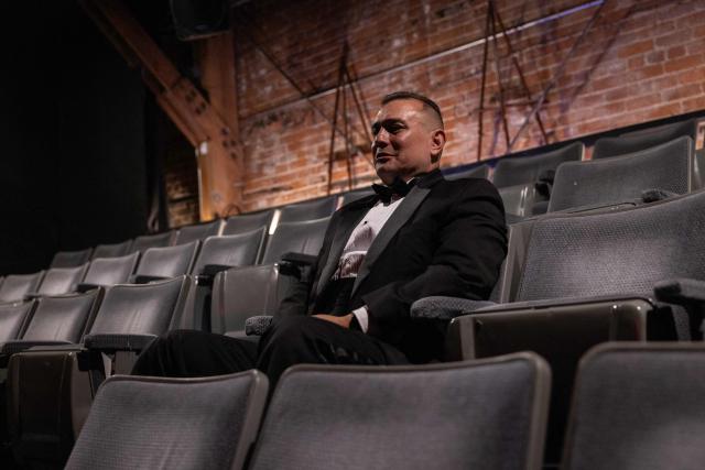 Background actor and organizer of the 8th Annual Los Angeles Union Background Actors Awards, Vincent Amaya, sits in one of the audience chair at the end the ceremony at the Broadwater, in Los Angeles, California, on February 15, 2026. (Photo by ETIENNE LAURENT / AFP)
