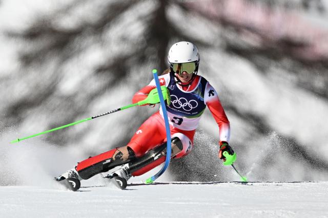Switzerland's Camille Rast competes in the first run of the women's slalom event during the Milano Cortina 2026 Winter Olympic Games at the Tofane Alpine Skiing Centre in Cortina d’Ampezzo on February 18, 2026. (Photo by Tiziana FABI / AFP)