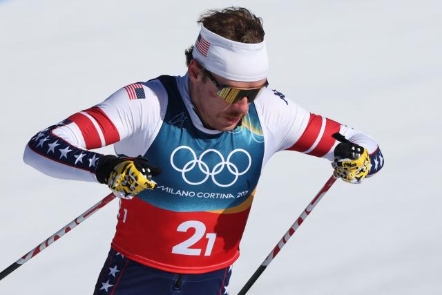 USA's Ben Ogden competes during the men's team cross country free sprint qualification event of the Milano Cortina 2026 Winter Olympic Games at Tesero Cross-Country Skiing Stadium in Lago di Tesero (Val di Fiemme), on February 18, 2026. (Photo by Anne-Christine POUJOULAT / AFP)