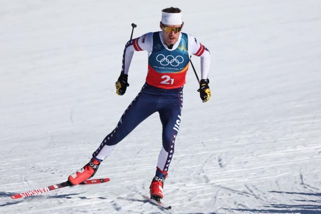 USA's Ben Ogden competes during the men's team cross country free sprint qualification event of the Milano Cortina 2026 Winter Olympic Games at Tesero Cross-Country Skiing Stadium in Lago di Tesero (Val di Fiemme), on February 18, 2026. (Photo by Anne-Christine POUJOULAT / AFP)