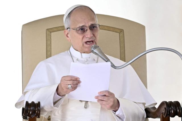 Pope Leo XIV addresses the crowd during the weekly general audience at St Peter's Square in The Vatican on February 18, 2026. (Photo by Filippo MONTEFORTE / AFP)