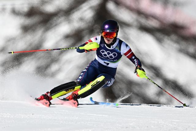 USA's Mikaela Shiffrin competes in the first run of the women's slalom event during the Milano Cortina 2026 Winter Olympic Games at the Tofane Alpine Skiing Centre in Cortina d’Ampezzo on February 18, 2026. (Photo by Tiziana FABI / AFP)