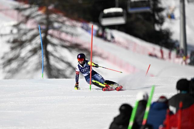USA's Mikaela Shiffrin competes in the first run of the women's slalom event during the Milano Cortina 2026 Winter Olympic Games at the Tofane Alpine Skiing Centre in Cortina d’Ampezzo on February 18, 2026. (Photo by Tiziana FABI / AFP)