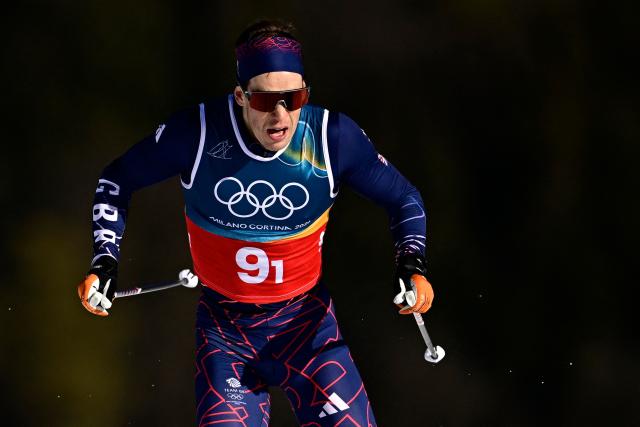 Britain's Andrew Musgrave competes during the men's team cross country free sprint qualification event of the Milano Cortina 2026 Winter Olympic Games at Tesero Cross-Country Skiing Stadium in Lago di Tesero (Val di Fiemme), on February 18, 2026. (Photo by Tobias SCHWARZ / AFP)