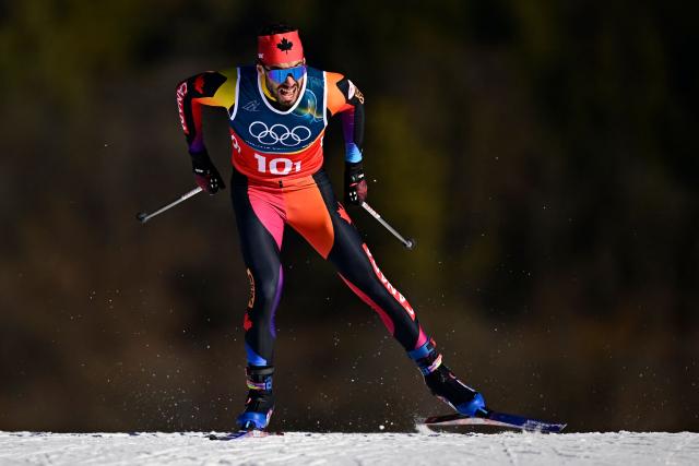 Canada's Antoine Cyr competes during the men's team cross country free sprint qualification event of the Milano Cortina 2026 Winter Olympic Games at Tesero Cross-Country Skiing Stadium in Lago di Tesero (Val di Fiemme), on February 18, 2026. (Photo by Tobias SCHWARZ / AFP)